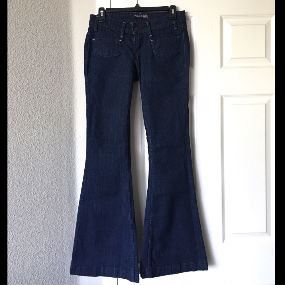 Flared Levi’s genuinely crafted, 7M,32 inseam, dark blue,excellent condition.